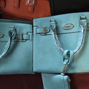 Blue Leather Tote Bag with Structured Design and Silver Hardware.